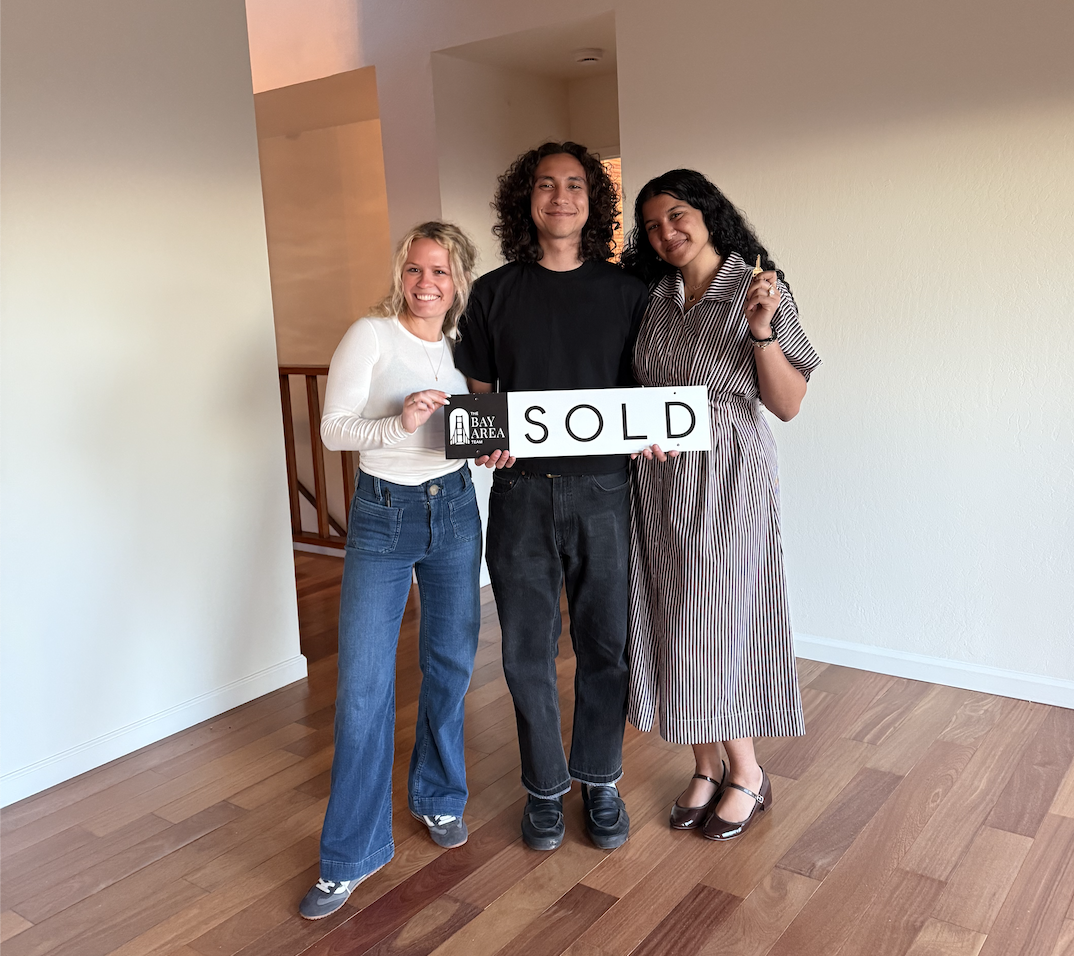 Buyer’s real estate agent reviewing home inspection and disclosures with clients in the East Bay