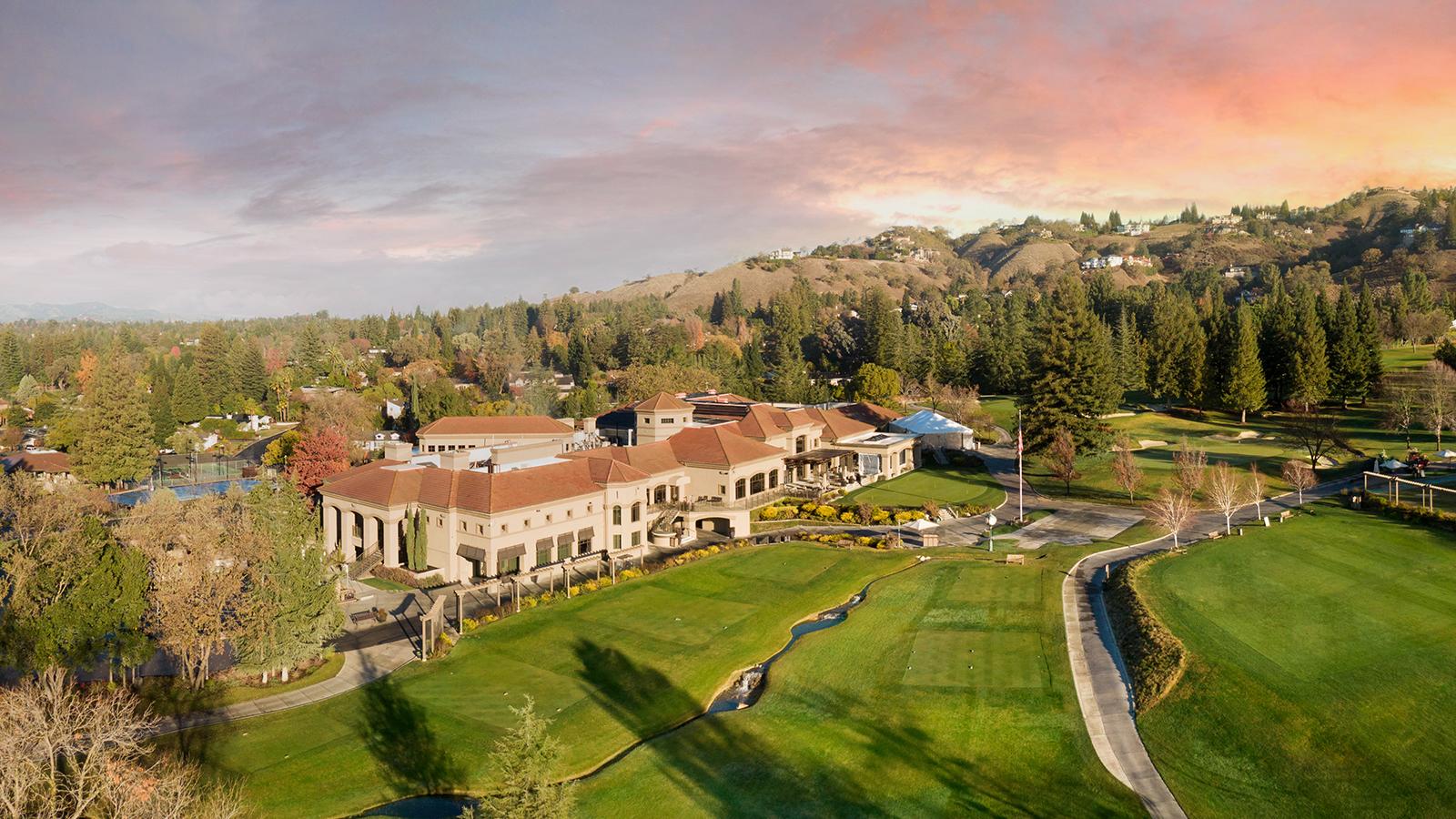 Entrance gate and landscaped streets within a luxury gated community in the San Ramon Valley, showcasing the privacy and lifestyle available in Danville, Alamo, Diablo, and San Ramon.